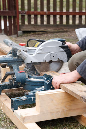 Carpenter sawing board with an electric circular saw