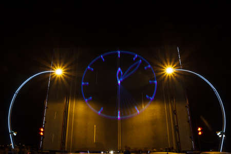 laser a projected clock on a drawbridge stage. new year concept