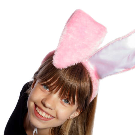 smiling girl with bunny ears on a white backgroundの写真素材