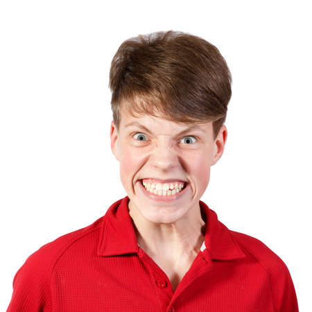 boy in red shirt with a big smile and wide eyes の写真素材
