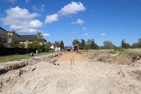 construction of a new street or reconstruction in suburbの写真素材