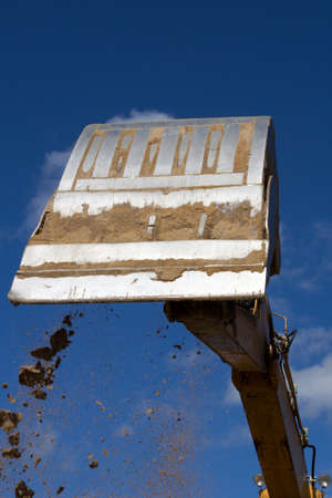 excavator bucket against the blue sky