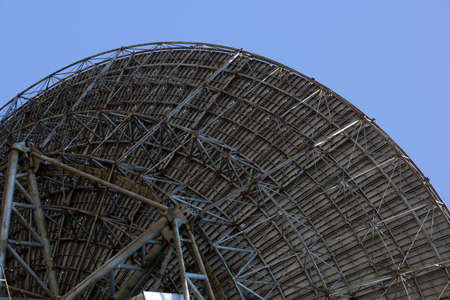 large radio telescope antenna on blue skyの写真素材