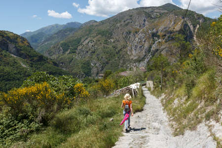 A woman hiking in a mountainous areaの写真素材
