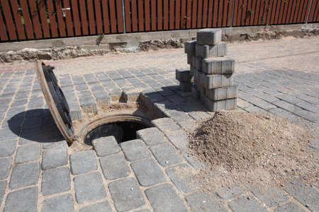 A manhole cover for a sanitary sewer access point