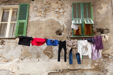 A bunch of clothes hanged on a line of stringの写真素材