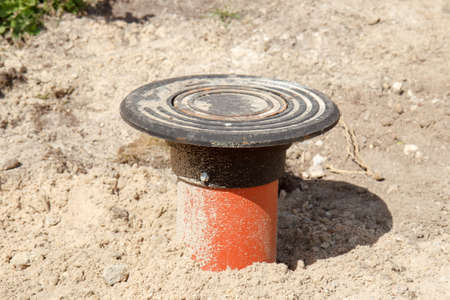 A orange sewer drainage pipe in a construction siteの写真素材
