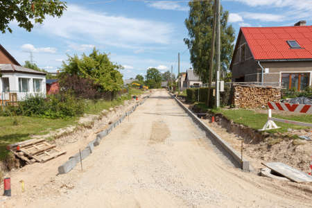 a unfinished road construction site with sandの写真素材