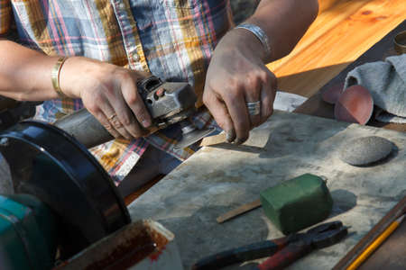 a craftsman make ethnic copper bracelet jewelryの写真素材