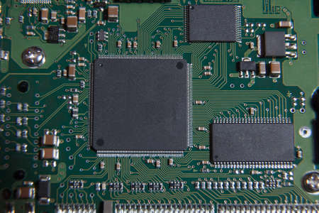 A green circuit board with some chipsetsの写真素材