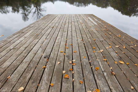 A set of wooden planks above waterの写真素材