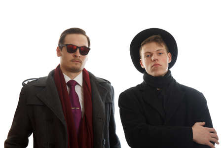 Two young well dressed businessman facing the cameraの写真素材