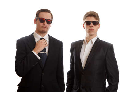 Two well dressed young adults on white backgroundの写真素材