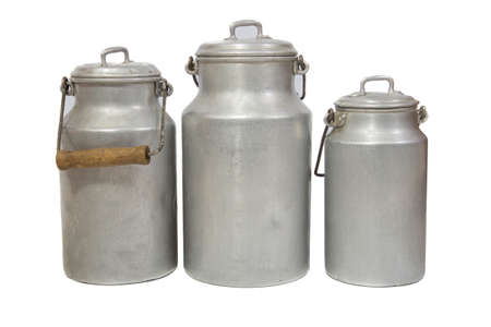 three retro aluminium milk cans on white backgroundの写真素材