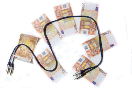 Audiophile concept. Stereo audio cable on banknotes.の写真素材