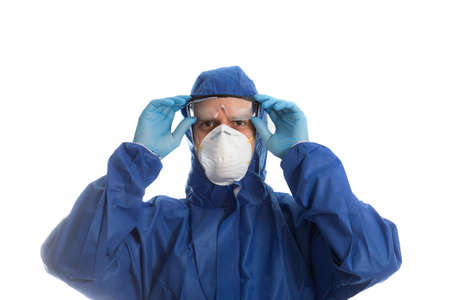 Doctor with protective clothing and goggles, face mask and endoscope
