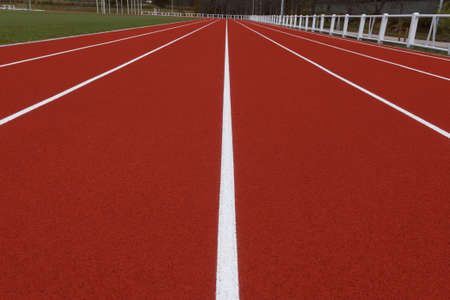 Running track in the small stadium. Rubber coating.