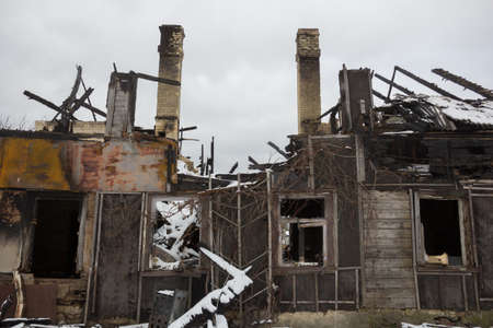 Burnt wooden house. House after the fire. House destroyed in a gas explosion .の写真素材
