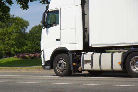 truck is driving on the streets of the city