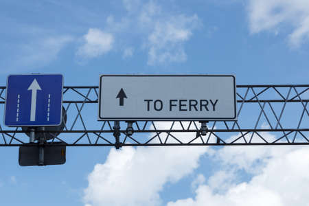 to ferry sign over blue sky. port entranceの写真素材