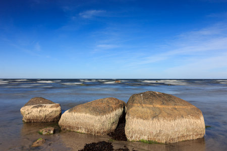 Unusually low water level in the Baltic Sea. All coastal rocks are visible.の写真素材