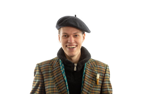 Young smiling artist with a beret on his head on a white backgroundの写真素材