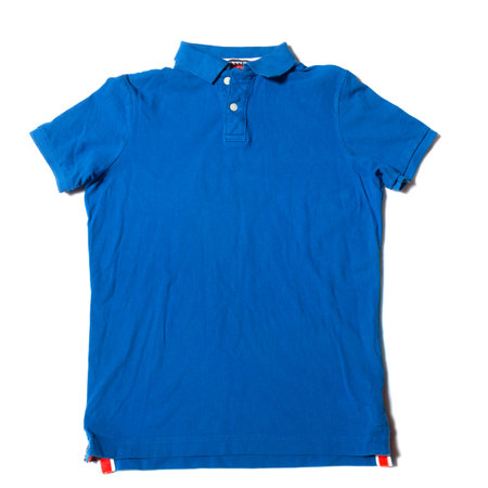 Blue polo shirt on a white backgroundの写真素材