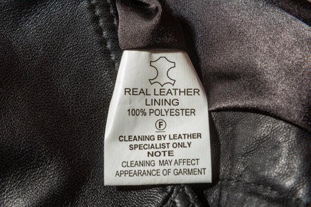 real leather written on material label on leather waistcoatの写真素材