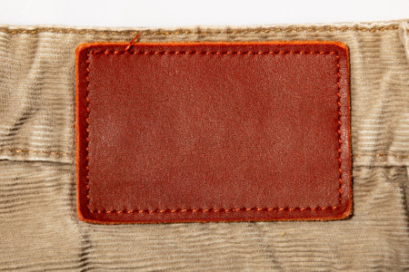leather patch on beige corduroy trousersの写真素材