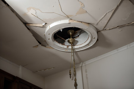 broken ceiling in the room and fallen chandelierの素材
