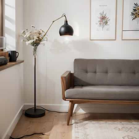 Stylish composition of home office interior with black wooden desk, chair, dried flower in vase, laptop, mock up poster frame, desの素材