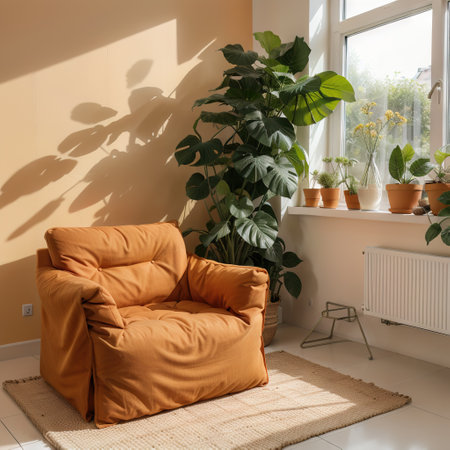 Stylish orange sofa with houseplants in modern interior of living roomの素材
