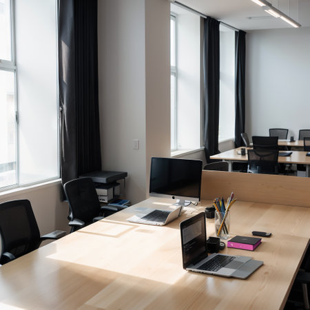 Modern business office without with blurred bokeh background. tables, chairs, computers. copy space. High quality photoの素材