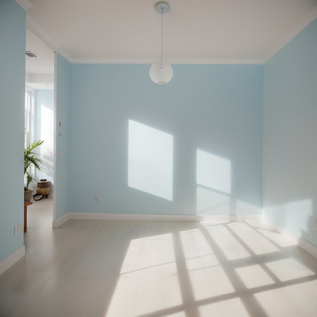 Light blue empty wall and smooth floor with interesting light glare. Background for the presentation.の素材