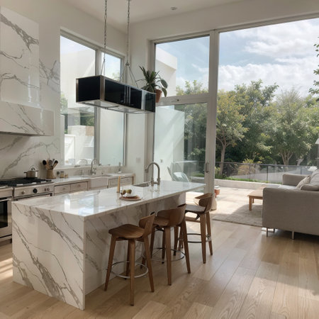 OAK PARK IL USA NOVEMBER 1 2020: A modern luxury grey kitchen with a white island looking out towards an open dining room anの素材