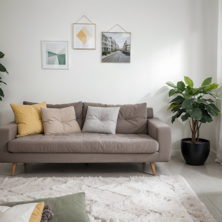 Soft sofa with pillows near color wallの素材