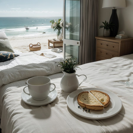 Breakfast tray and magazine on bed overlooking oceanの素材