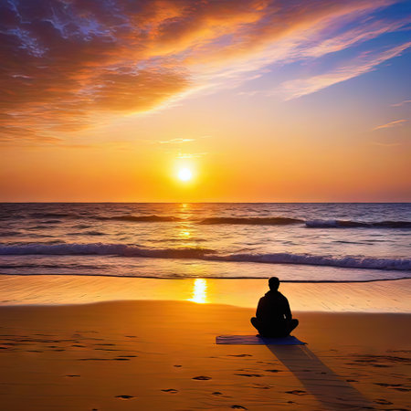 Rear view of a sitting at coast and watching theの素材