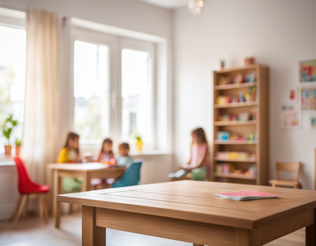 Wooden table with blurred background of kids room and windowの素材