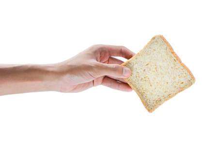 The hand holding Whole wheat bread isolated on white background.