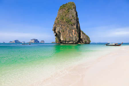 Rock on white sand beach in Krabi, Thailandの写真素材