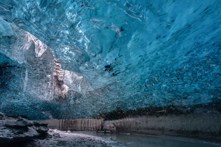 Inside an ice cave in Vatnajokull, Iceland. The ice is thousands of years old and so packed it is harder than steel and crystal clear.の写真素材