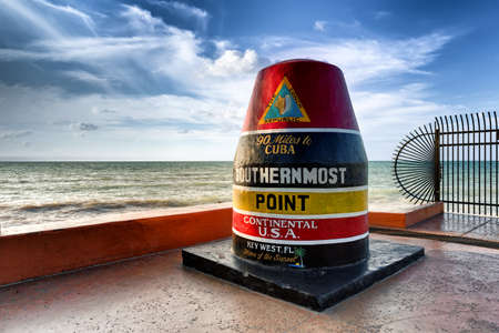 The Key WestBuoy sign marking the southernmost point on the continental USA and distance to Cuba, Floridaの写真素材
