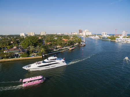 FORT LAUDERDALE, FLORIDA - 28 JAN 2017: Taxi Boat and Yacht floating in Fort Lauderdale bay. Aerial view.のeditorial素材