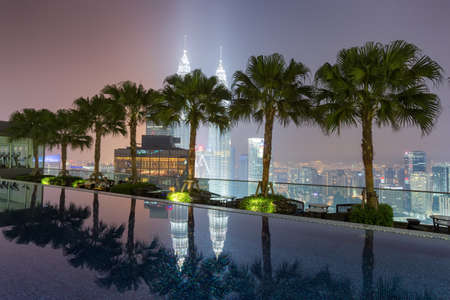 Kuala Lumpur, Malaysia - April 18, 2015: Petronas Twin towers with reflection in a water, Kuala Lumpur central park, KLCCのeditorial素材