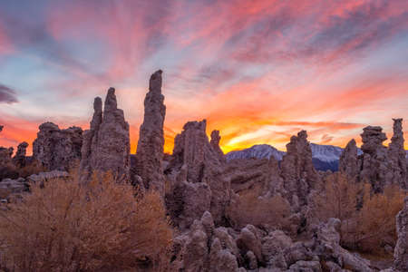 Sunset at Mono lake, California. Bizarre calcareous tufa formation on the smooth water of the lake.の写真素材