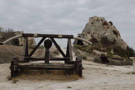 Les Baux-de-Provence, France - OCTOBER 21, 2017: View of the ancient siege weapon (ballista, catapult) and the ruins of a medieval castle on the cliff in the backgroundのeditorial素材