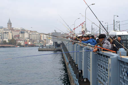 ISTANBUL, TURKEY - OCTOBER 23, 2018: Street scene. Galata Bridge (Galata K?pr?s?) filled with alley in the Golden Horn Bayのeditorial素材