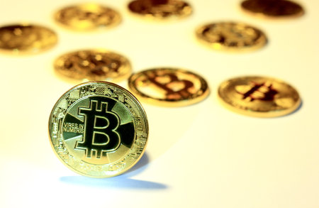 Bitcoin souvenir coins. Cryptocurrency golden bitcoin coin. Conceptual image for worldwide...