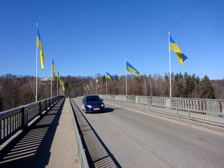 Lots of Ukrainian flags on the bridge over the river Gauja near Siguldaのeditorial素材